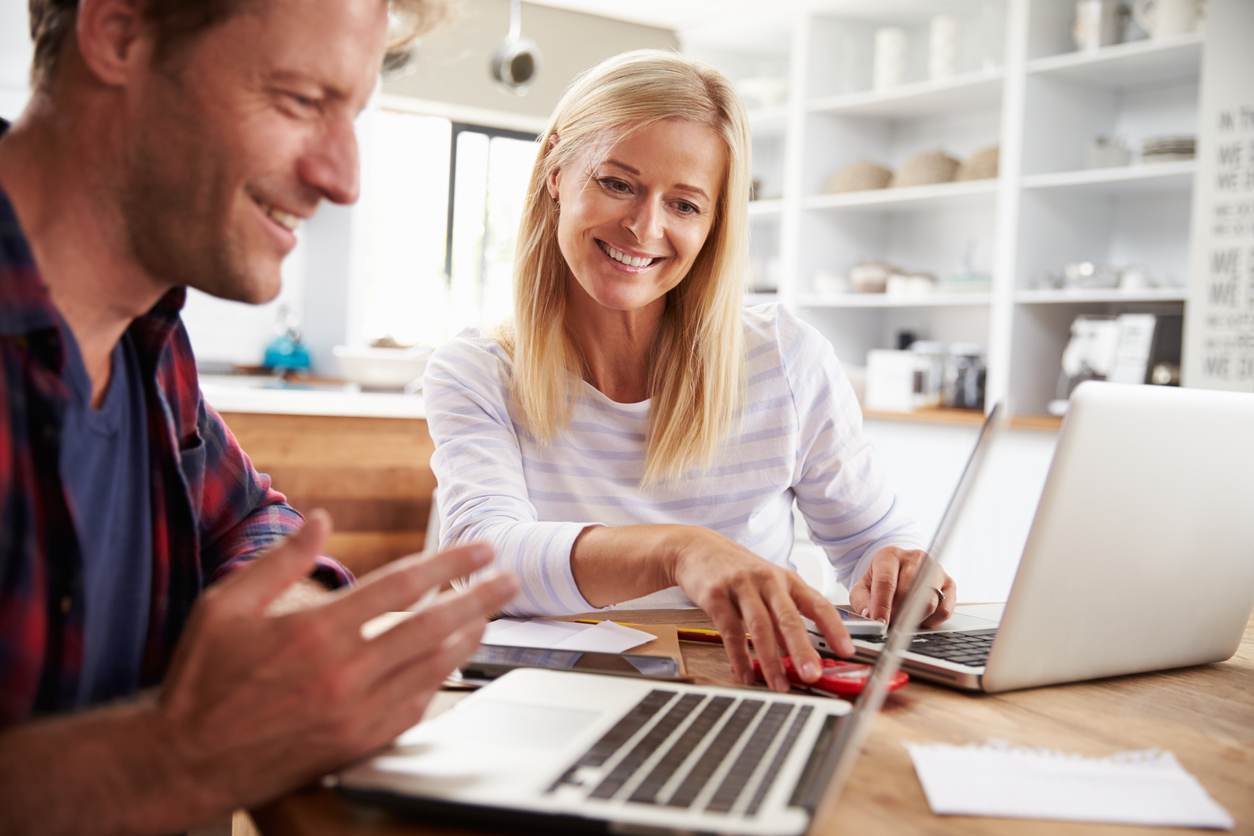 Man-and-woman-working-together-at-home-475855756_1258x838